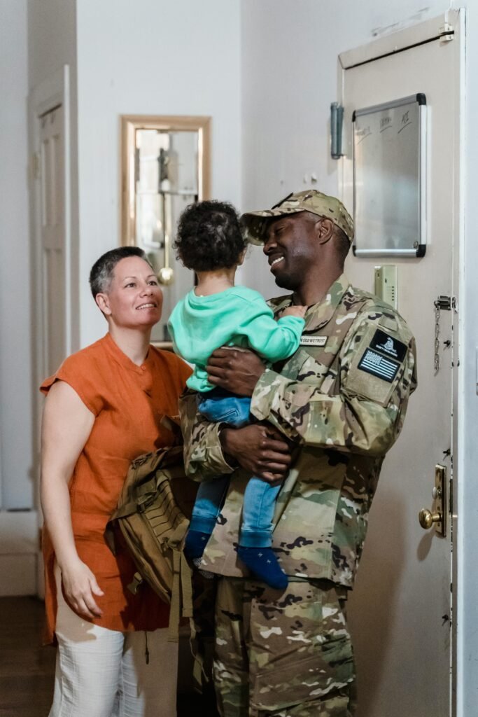 A touching scene of a soldier reuniting with family at home, capturing joy and love.